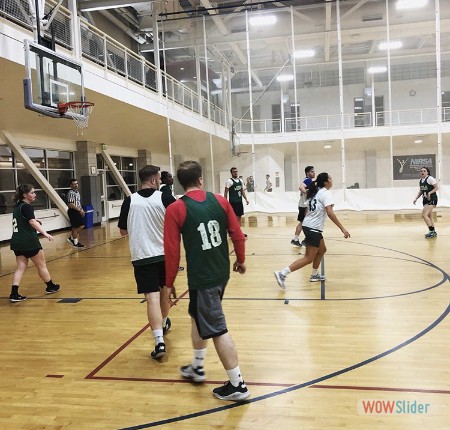an image of students playing basketball