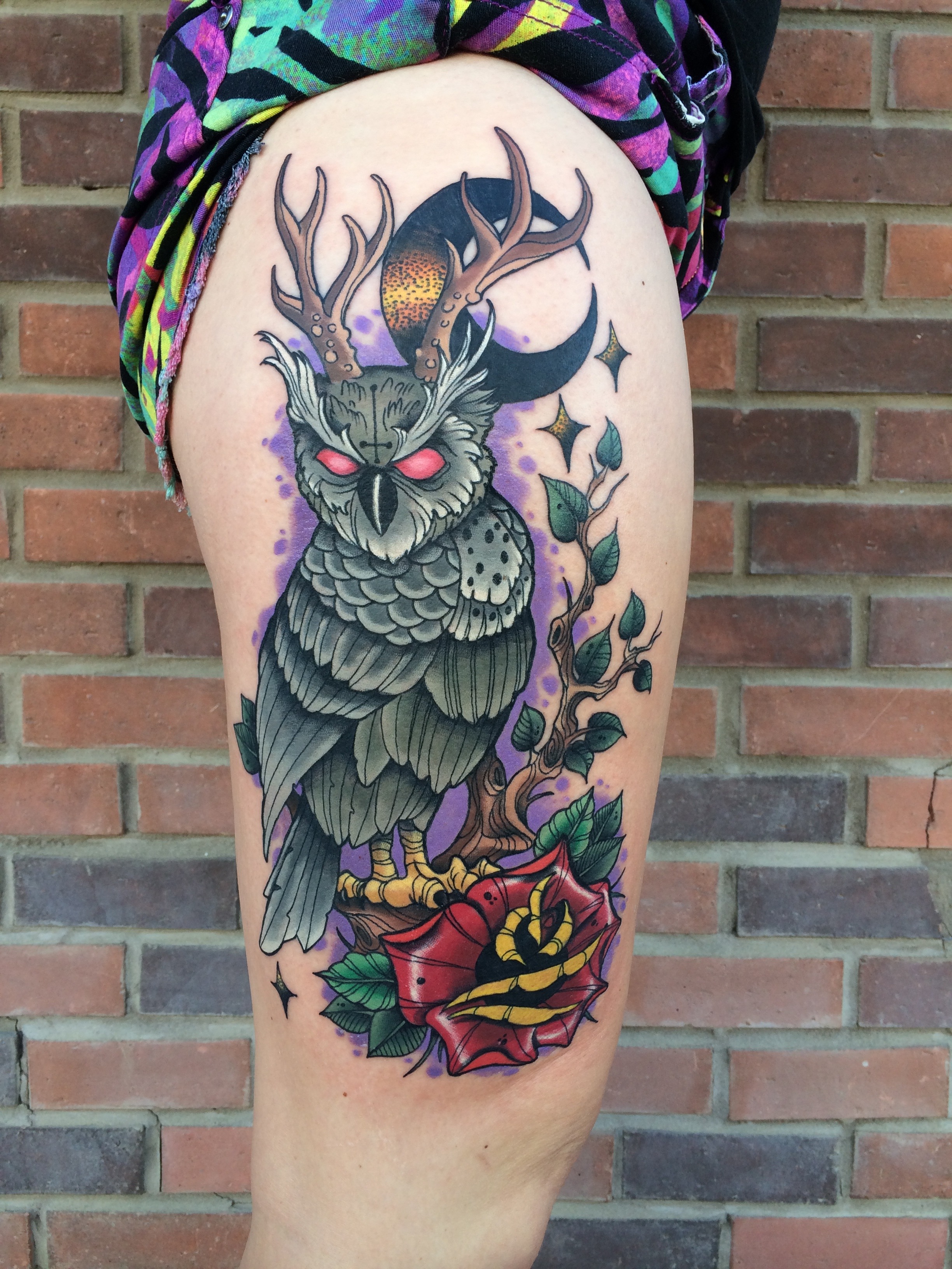  Photo of an owl tattoo, done in an illustrative style