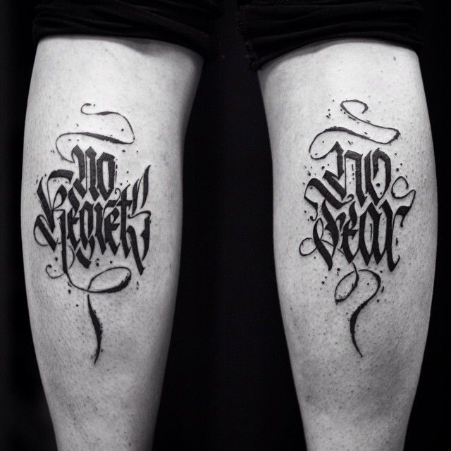 Photo of letting tattoo saying 'No Regrets. No Fear'